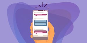 Human hand holding smartphone with online text messages