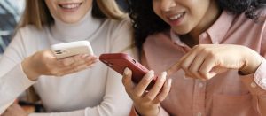 close-up-women-holding-smartphones